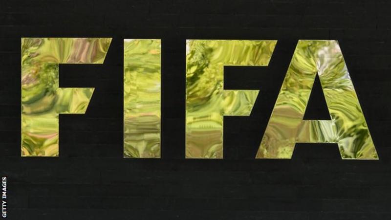 FIFA logo with reflective gold finish on black background.