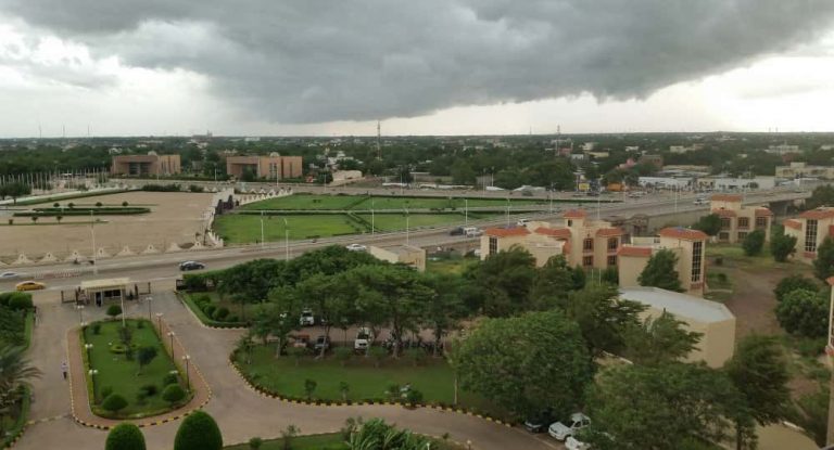 Storm approaching N'Djamena, Chad's capital, with dark clouds over the cityscape.