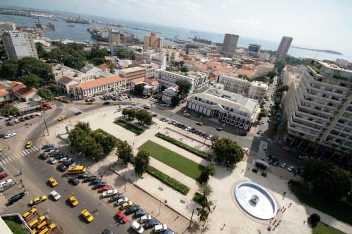 Urban cityscape with modern buildings and waterfront in Africa.