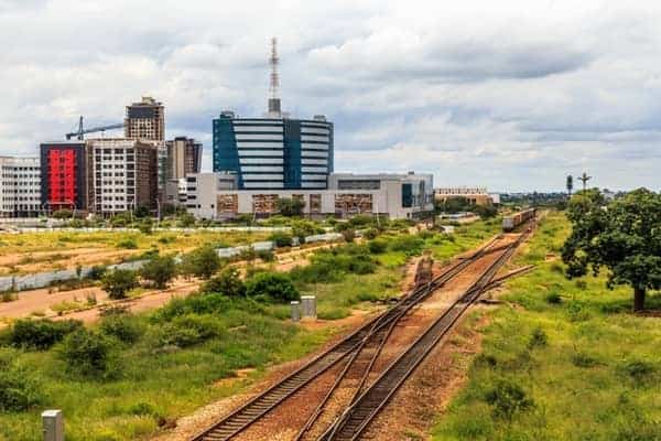 Urban skyline with railway tracks in an African city highlighting infrastructure and economic develo.
