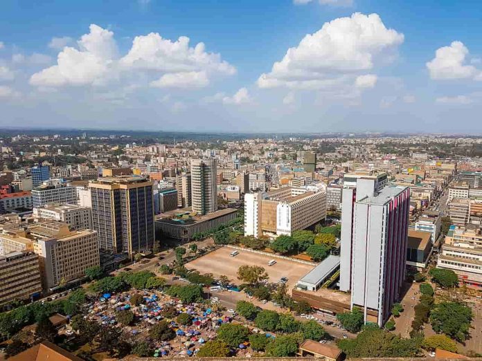 Urban skyline of a major African city with tall buildings and a busy downtown area.