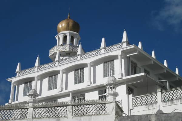 Mosque with golden dome and white walls in Africa.