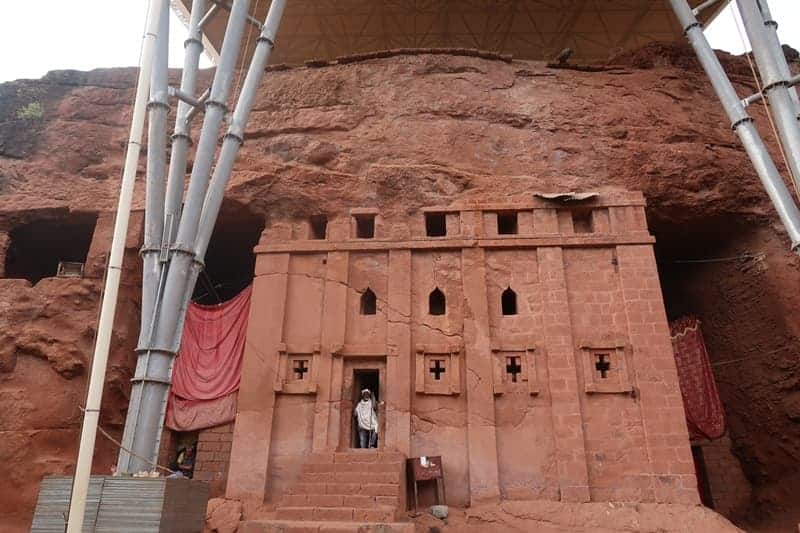 Ancient rock-hewn church carved into red stone in Ethiopia's UNESCO site.