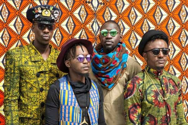 Diverse African fashion styles showcased by young adults in colorful traditional attire and accessor.