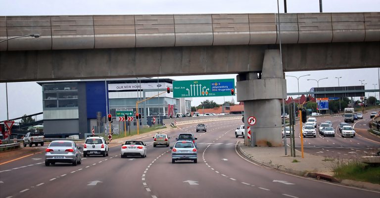 Modern highway in Africa showcasing infrastructure for multinational business expansion.