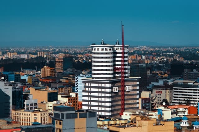 High-rise hotel building in Nairobi, Kenya, with city skyline background.