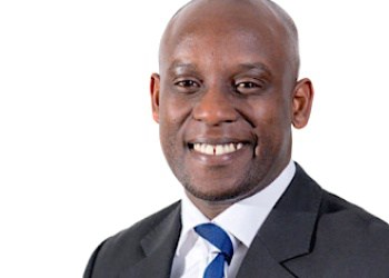 Business professional in a suit, representing East Africa's digital infrastructure growth.