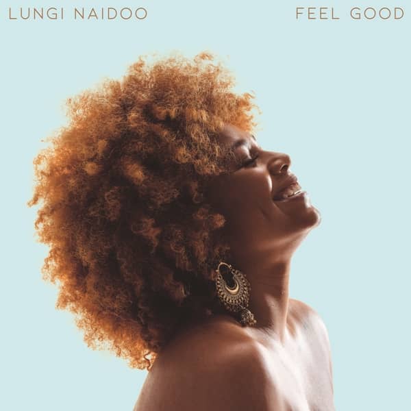 Lungi Naidoo smiling with Afrobeat-inspired hairstyle for her new single "Feel Good".