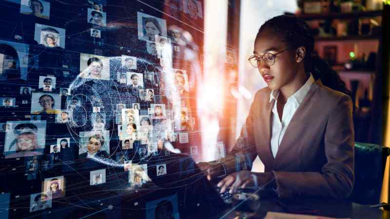 Young professional woman engaging with digital workforce network.