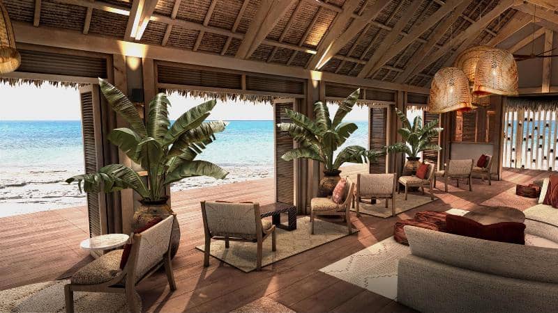 Beachfront lounge at Banyan Tree Ilha Caldeira, Mozambique, with tropical plants and ocean views.