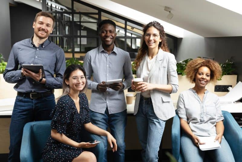 Diverse group of professionals collaborating in a modern office environment.