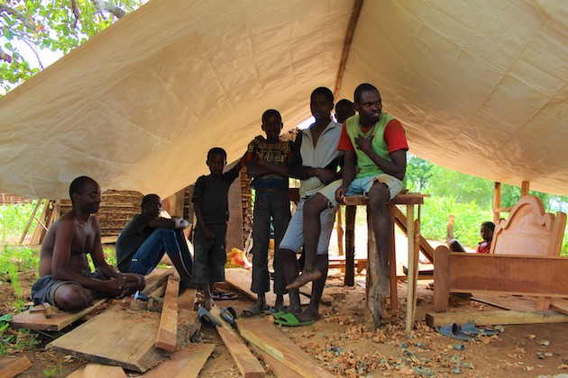 Community leaders gather inside a temporary shelter amid ongoing crisis in Mozambique.