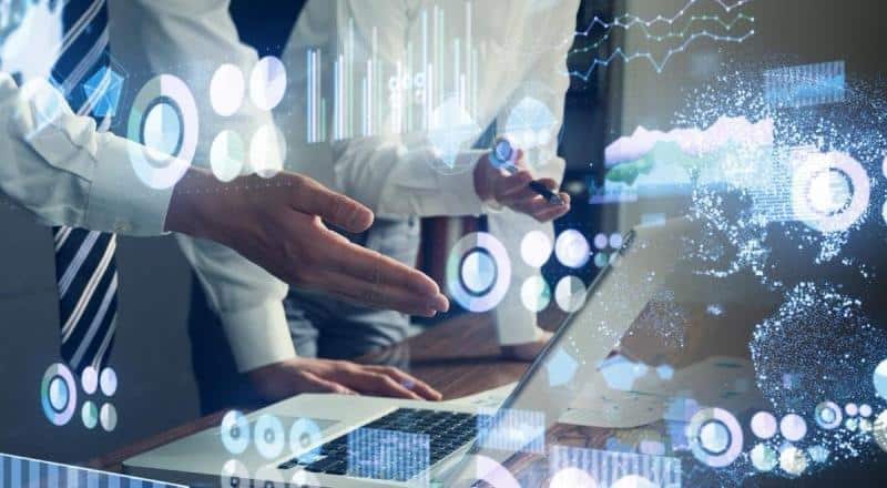 People collaborating with digital technology to bridge the digital divide in Africa.