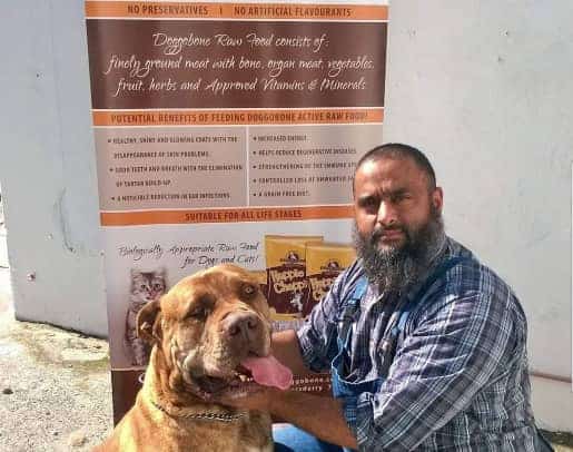 Community entrepreneur with a dog, highlighting local business impact on the economy.