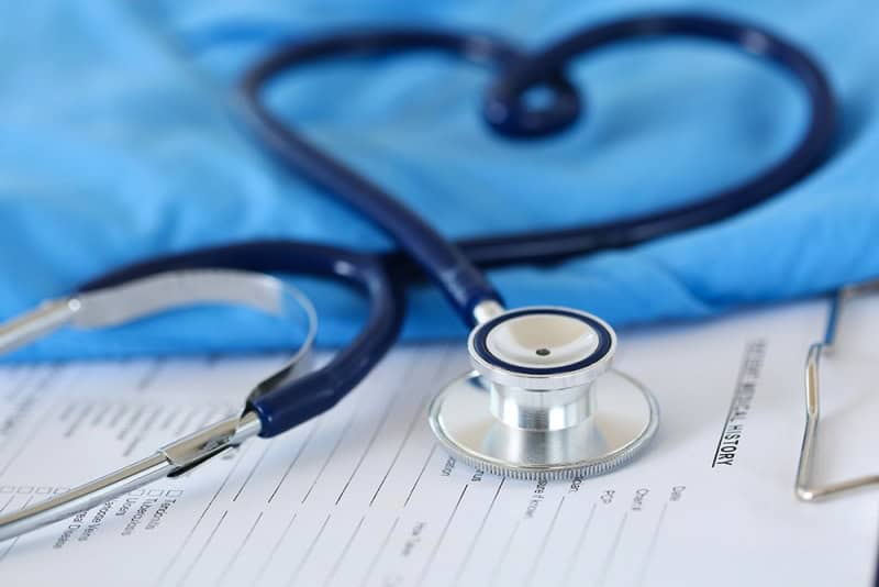 Stethoscope on medical documents highlighting health issues in Africa.