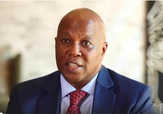 African small business leader speaking at a conference.