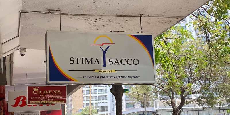 Stima Sacco office building in Kenya with company signboard.