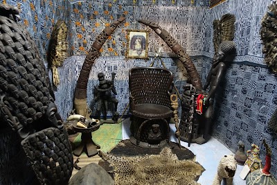 Traditional Cameroon cultural artifacts and decor in a museum setting.