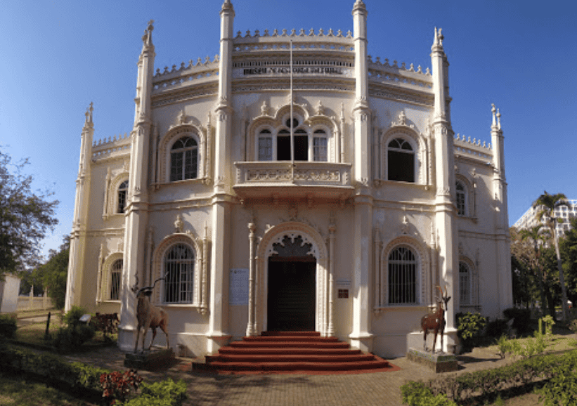 Historic colonial palace in Mozambique with ornate architecture and white facade.