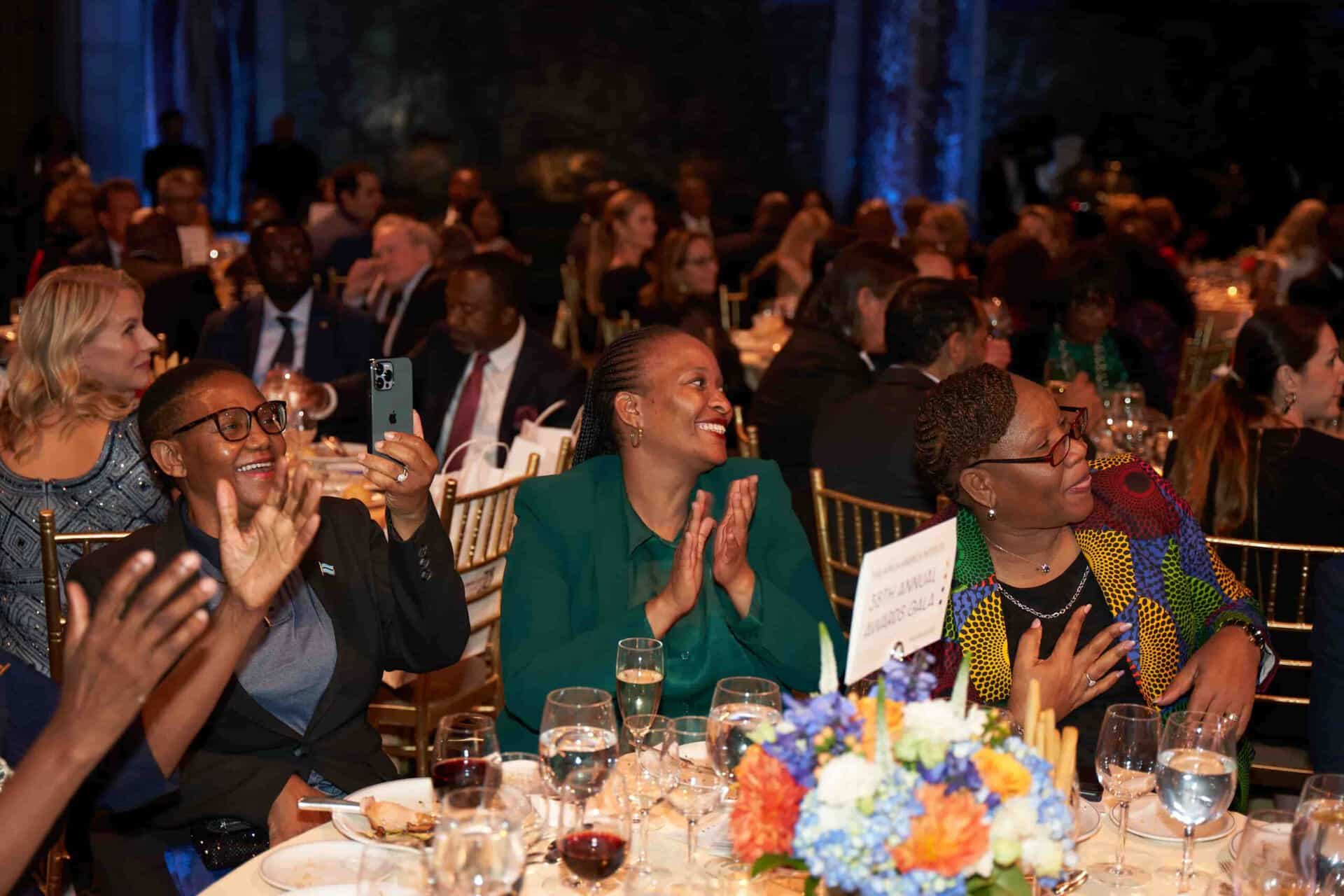 Vibrant African celebration with diverse attendees enjoying a formal event.
