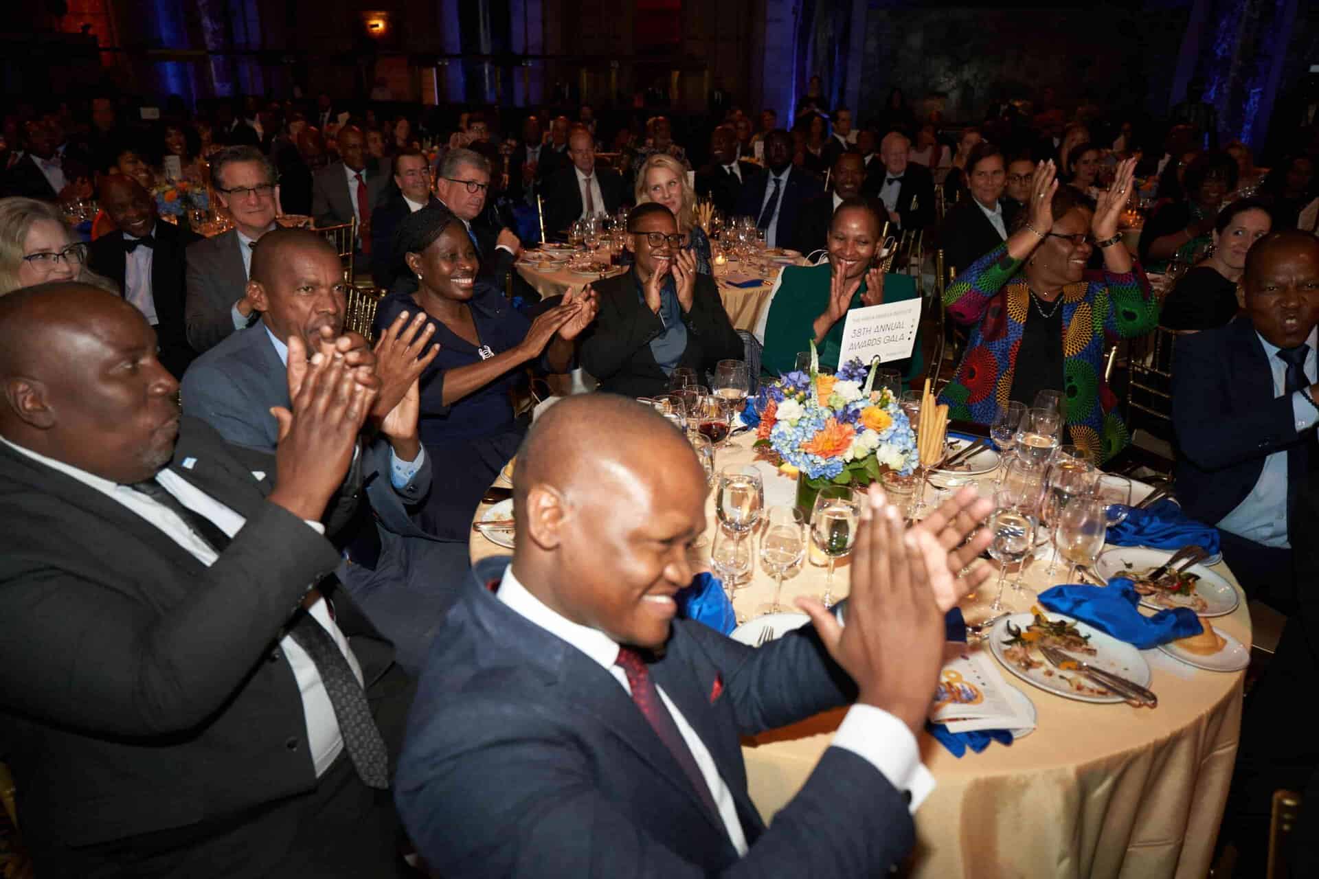 Business leaders celebrating at Africa conference event.