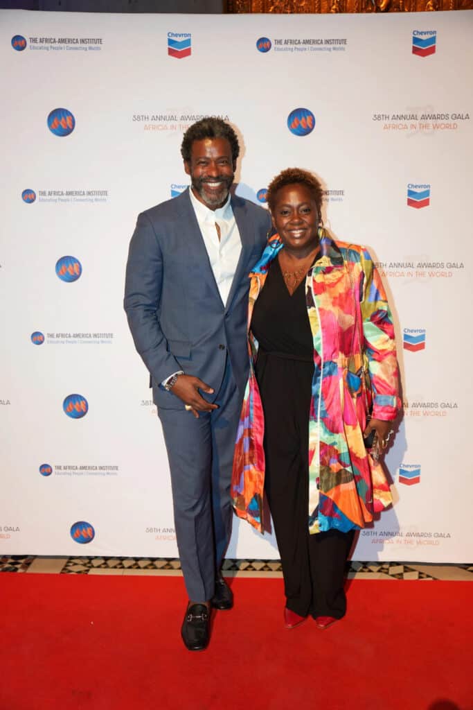 African man and woman smiling at the Africa.com awards event.
