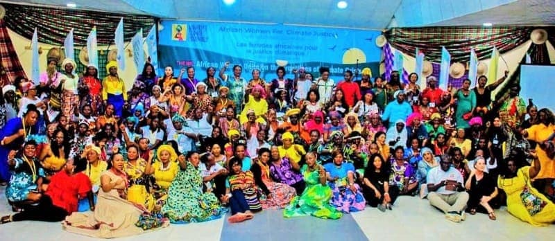 Empowered African women gather to demand climate action and justice at a vibrant rally.