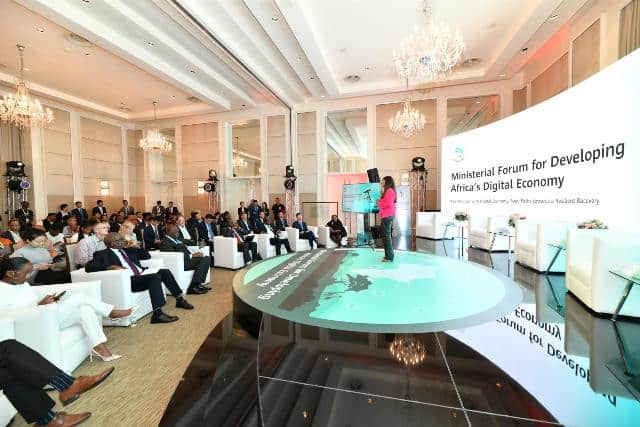 Ministerial forum on Africa's digital economy with attendees and a speaker on stage.
