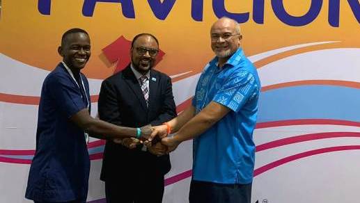 Parties shake hands after signing historic agreement on global risk pools.