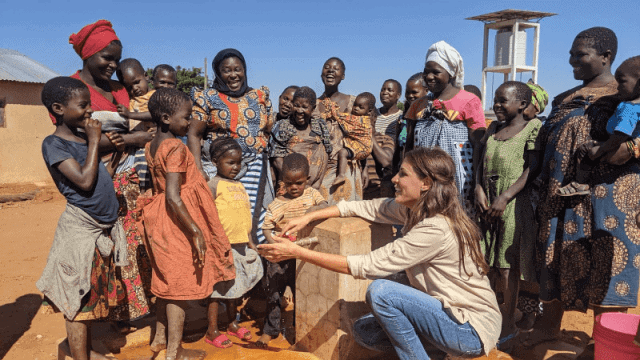 Community gathering highlighting water access issues in Africa.