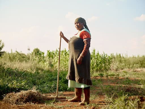 Woman working in a soil farm, promoting soil health and sustainability in Africa.
