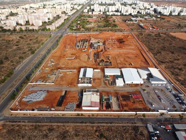 Aerial view of hospital construction in Angola funded by Standard Chartered social loan.