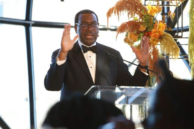 African mayor speaking at urban development event in a formal setting.