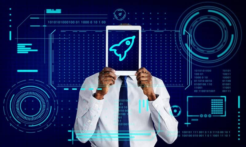 Person holding a tablet with a rocket icon, symbolizing fintech growth in Africa.