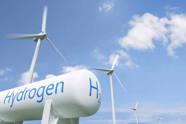 Wind turbines and hydrogen storage tank for green energy in Namibia.