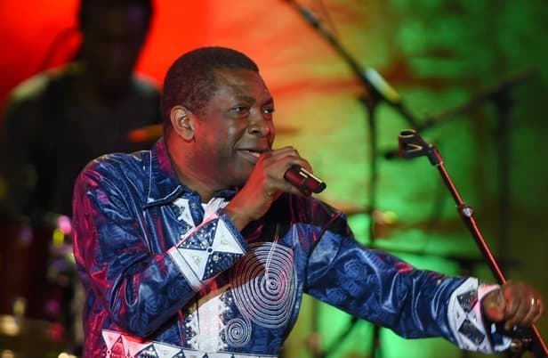 Youssou N’dour, renowned African musician, passionately performs at the 8th All-Africa Music Awards.