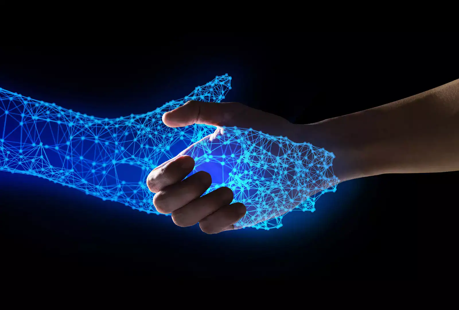 Digital handshake between human hand and AI-generated hand, symbolizing AI advancements.