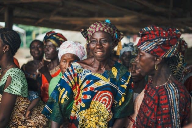 Women leaders participating in community discussions in Sierra Leone.