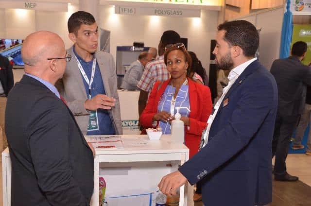 Ethiopian construction professionals engaging with international exhibitors.
