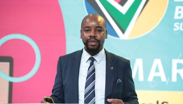 Business professional speaking at the Proudly SA Buy Local Summit.
