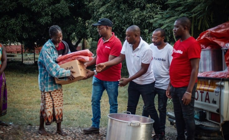 Mozambican staff distribute aid to cyclone victims in Mozambique.