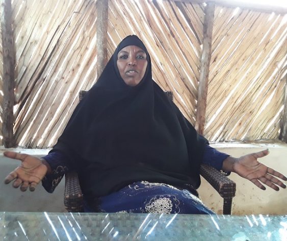Empowered woman speaking at Women Council of Elders meeting in North Eastern Kenya.