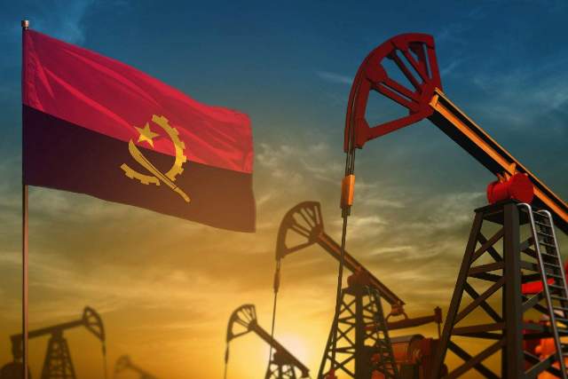 Oil and gas extraction rigs with Angolan flag in the background.