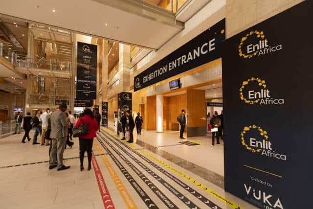 Entrance to Enlit Africa 2023 energy event in a modern conference center.