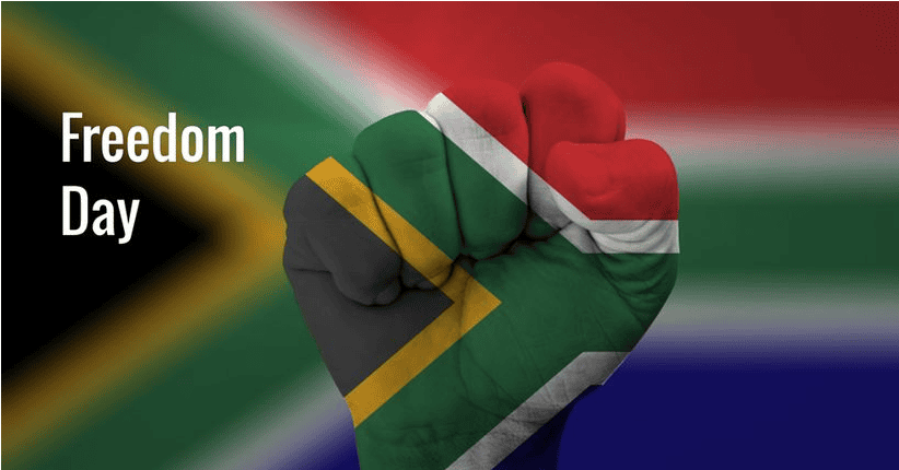 Fist painted with South African flag colors celebrating Freedom Day 2023.