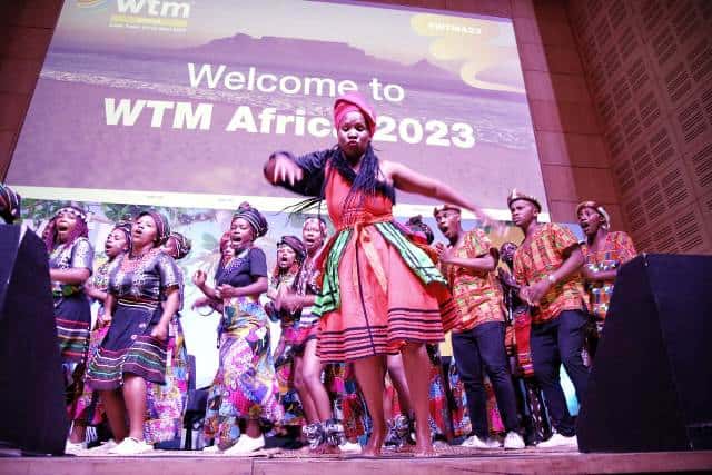 Dynamic traditional dance performance at WTM Africa 2023 showcasing African culture and tourism.