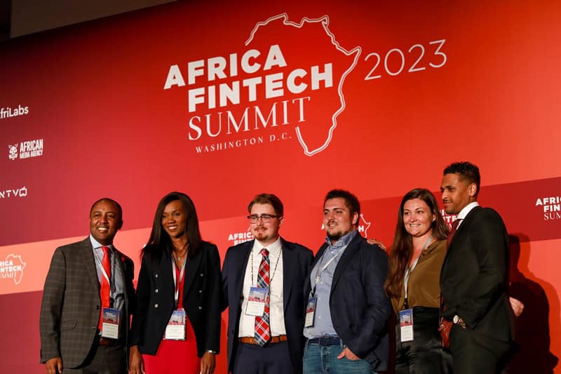 Diverse professionals attending the Africa Fintech Summit 2023 in Lusaka, Zambia, celebrating fintec.