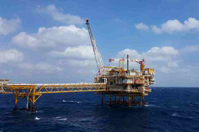 Offshore oil platform with crane in the Atlantic Ocean, highlighting energy development in the MSGBC.
