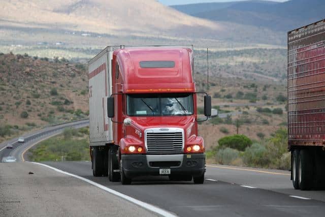 Transport truck on African highway supporting trade and logistics development.