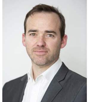 Business professional in formal attire, representing African private equity growth.